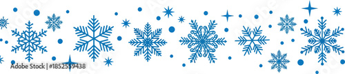 A festive arrangement of blue snowflakes and sparkling stars on a white background for winter or holiday themes