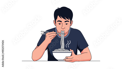 Young man enjoying a delicious bowl of steaming noodles with chopsticks