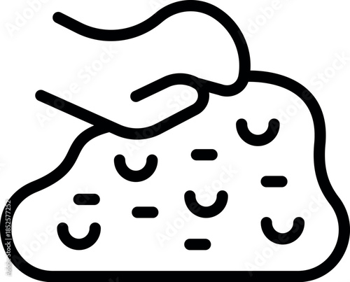 Close up of a hand gently pressing a textured surface, highlighting its softness and porous nature