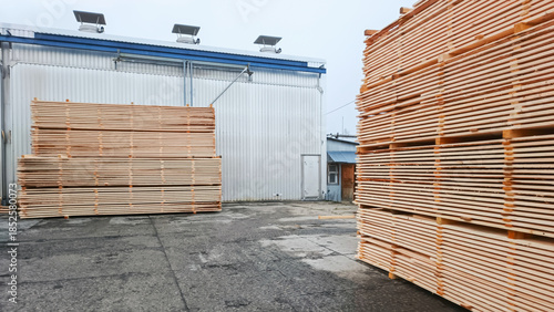 Lumber is stacked next to the drying chamber.