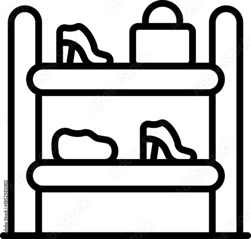 Elegant shoes and a handbag sit on retail display shelves, ready for purchase in a fashion boutique