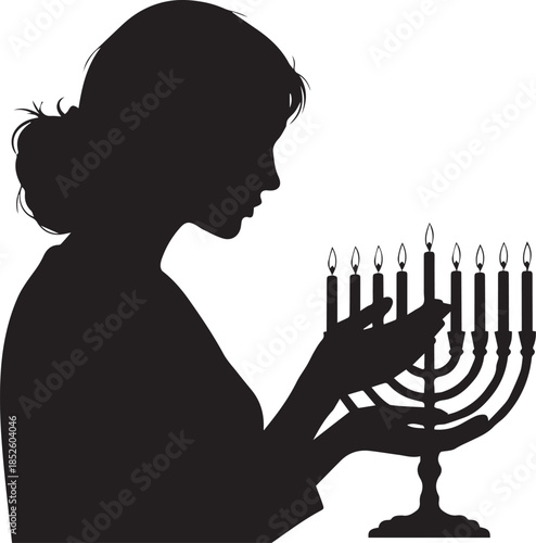 Woman lighting menorah