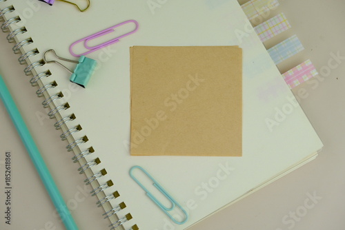 blank paper next to school tools with no word as a template for text space concept. business and education concept