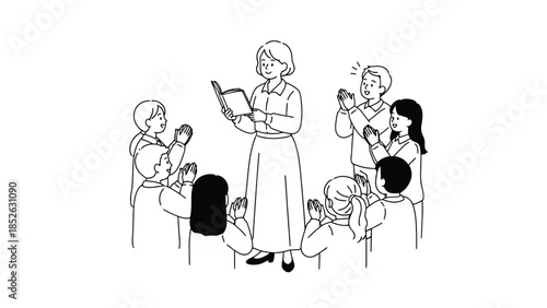 Happy family and children clapping together in a circle with a book