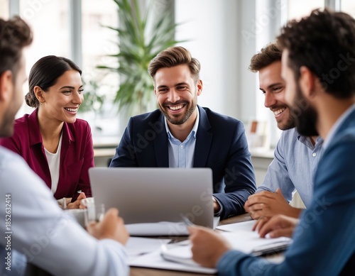 A businessman holds a project meeting and works on a laptop in an office among colleagues.