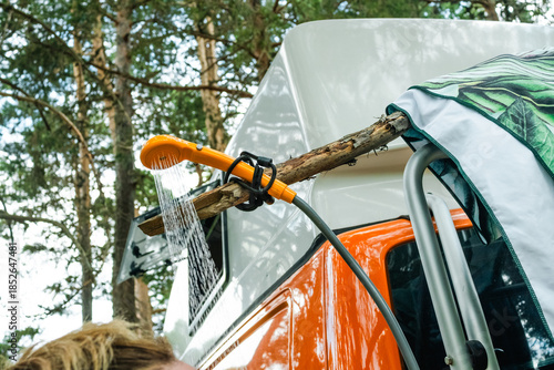 Campervan outdoor shower setup with running water