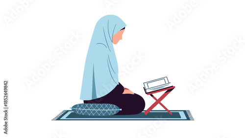 Muslim woman in hijab reading Quran on prayer mat with laptop