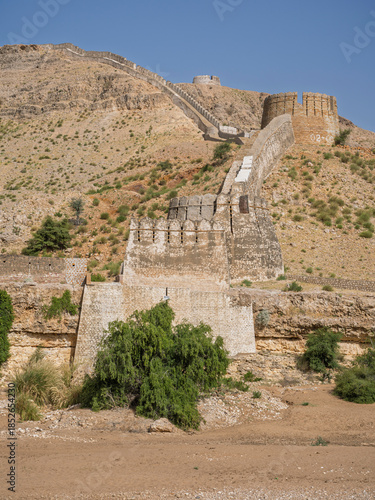 Vertical landscape view of Sann gate ramparts at ancient Ranikot fort aka the Great Wall of Sindh in remote desert near Jamshoro, Sindh, Pakistan