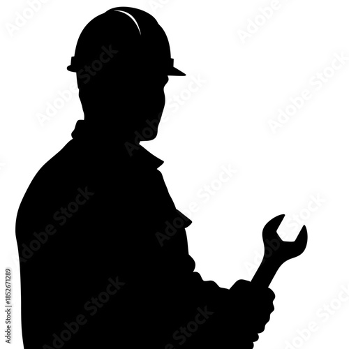 Silhouette of a worker holding a wrench with hard hat