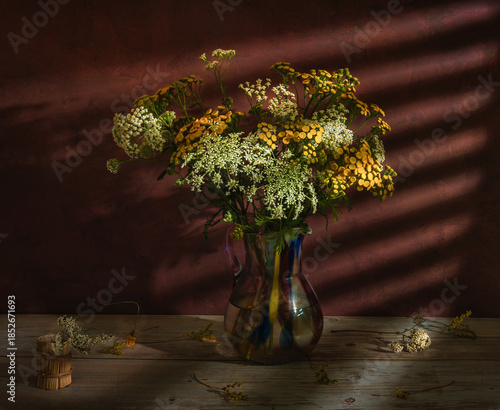 A bouquet of meadow flowers close-up on a dark background.