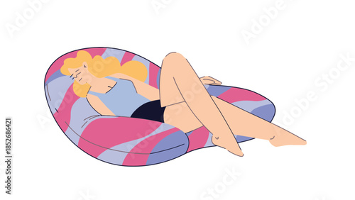 Blonde woman relaxing on a colorful bean bag chair in a calm peaceful setting