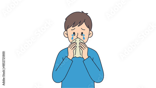 Sad boy crying and blowing nose with tissue
