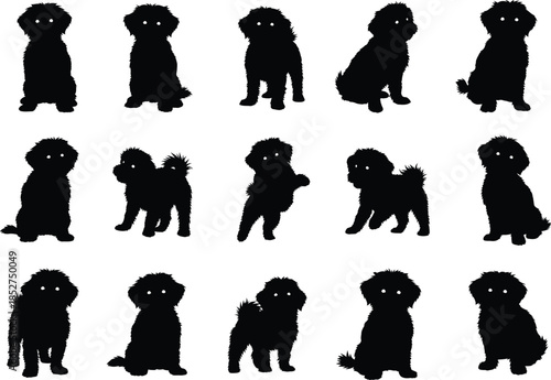 Collection of black dog silhouettes in various poses on white background