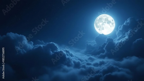 A full moon shines brightly through dark, dramatic clouds in a night sky.