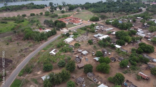 Wallpaper Mural Aerial drone footage of Ghana, Africa, serene lake, rolling mountains and natural landscape. Boats on the water. A local village, near the Right to Dream Football Academy. Torontodigital.ca