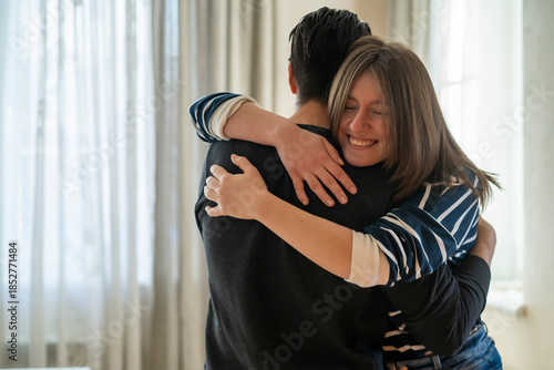 Schilderij op canvas A couple in romantic relationship, girl warm hugs a man.