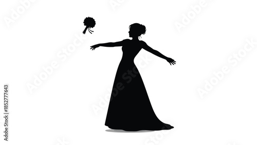 Silhouette of a bride in a long dress tossing her bouquet in a celebratory wedding moment