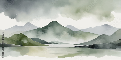 A serene morning mist blankets the mountain lake at sunrise as the peak reflects in the still water of this summer landscape valley