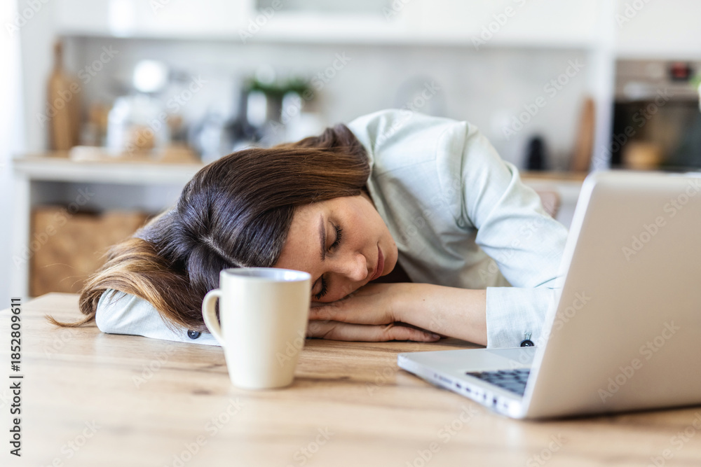 Fototapeta premium Tired, sleeping and woman on laptop for remote work exhausted for project, report and working from home. Stress, overworked and female person with burnout for nap, relaxing and resting from fatigue.
