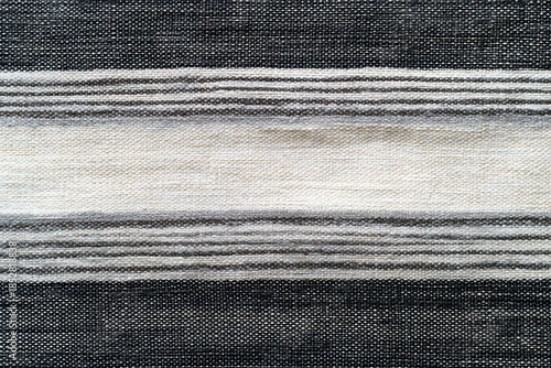 Striped fabric texture pattern textile woven linen black white gray horizontal stripe natural fiber coarse weave rustic neutral tone minimal style. Calm, simple, tactile surface for background use