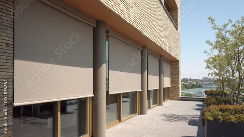 Modern outdoor roller blinds on a building balcony for solar protection and privacy