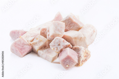 Slika na platnu Light purple taro cubes with fibrous texture, peeled and cooked, showcasing starchy root vegetable used in global cuisines