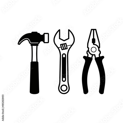 Essential tools like hammer, adjustable wrench, and pliers ready for any construction, repair, or DIY project