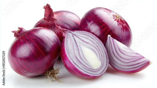 Group of fresh red onions, whole and halved, isolated on white background
