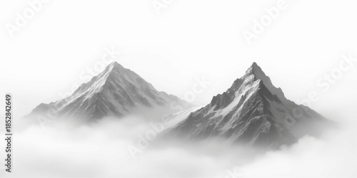 Two snowy mountain peaks rising above foggy clouds