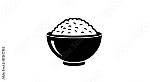Black bowl filled with rice grains.