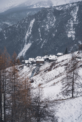 village huts in winter in snowfall