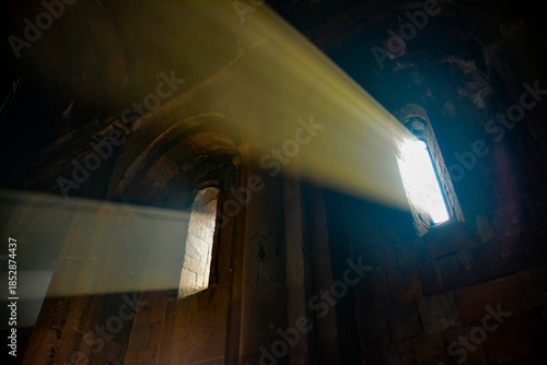 Monastery interior. An old lamp in the church. Sunlight streaming through the windows. Christianity and religion.
