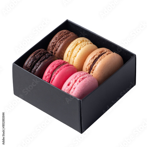A selection of colorful macarons, displayed in a dark box against a stark black background