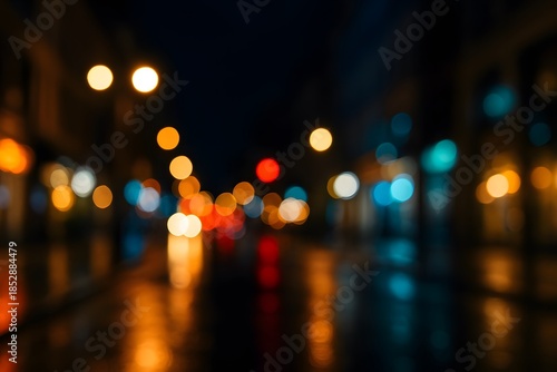 A bokeh city street background at night with lights and reflections