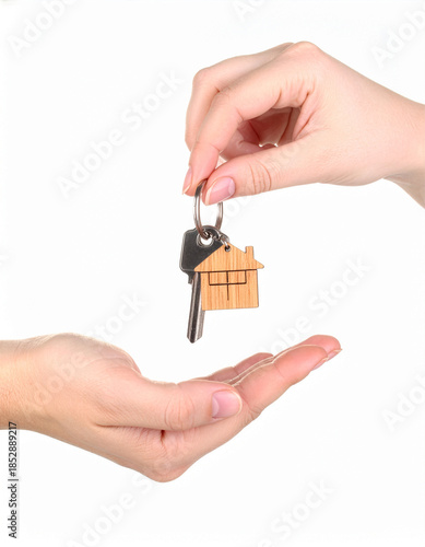 A professional real estate concept featuring a person holding a small house model in their hands to represent property investment, home insurance, and residential mortgage loan opportunities