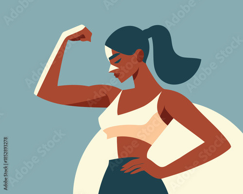 Strong woman flexing her muscles in a powerful pose with confidence and determination