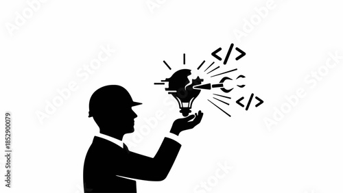 Silhouette of engineer holding a glowing lightbulb representing innovation and digital creation