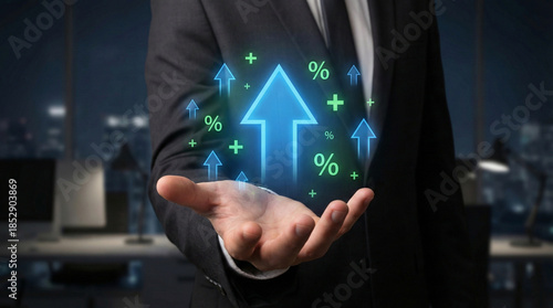 Businessman's hand holds glowing holographic upward arrows, percentage, and plus signs, symbolizing financial growth, profit increase, and business success