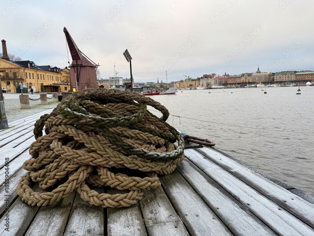 Obraz premium fishing boats in the harbor in Stockholm, rope on the bridge