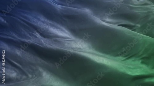 Wallpaper Mural Abstract background texture featuring smoothly draped and flowing silk or satin fabric with dramatic blue and green color gradients Torontodigital.ca