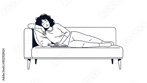 A person is resting comfortably on a sofa with a book.