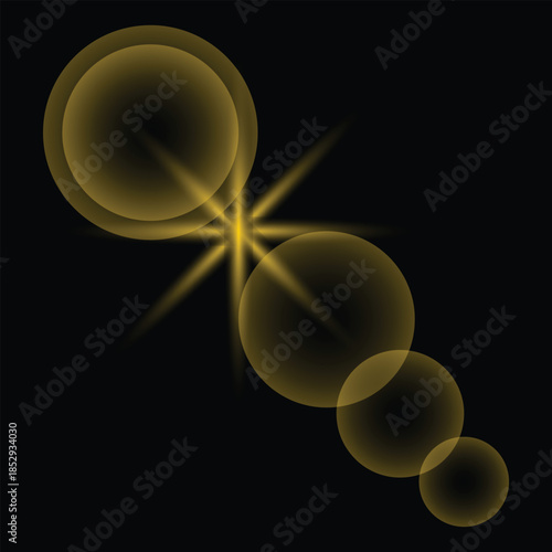 Golden light burst with lens flares and glowing orbs on black background