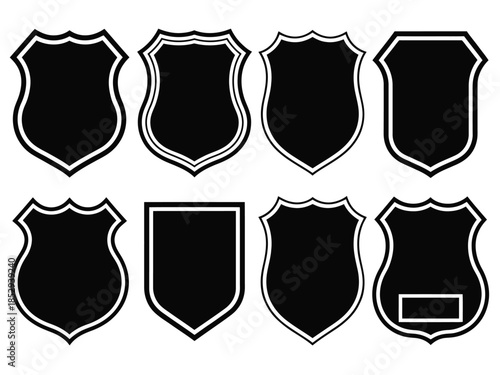 A collection of various black shield shapes with white outlines