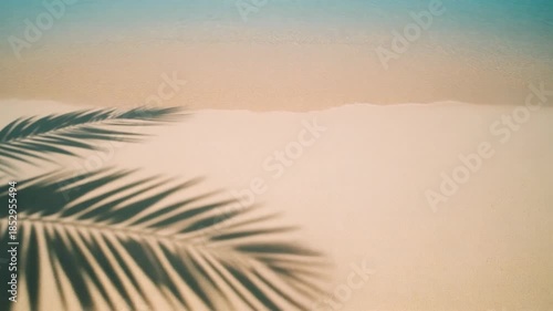 Wallpaper Mural Tropical beach scene with soft waves gently caressing the golden sand, adorned with elegant palm leaf shadows, creating a serene and captivating summer vacation paradise. Torontodigital.ca