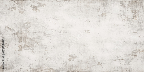 An antique aged grey concrete surface with a dirty textured pattern and rough paint creates a blank vintage grunge wall background for a weathered stone cement backdrop design