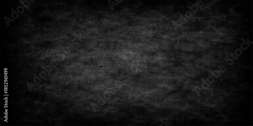 Aged dark grunge background featuring a textured black and grey concrete wall pattern with an empty vintage paper frame and rough blackboard design