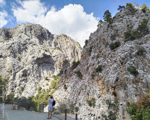 Path toward dramatic limestone mountains in Goynuk canyon, Turkey. Walk along rocky canyon road.