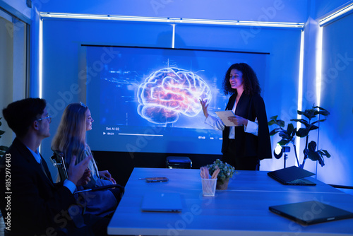 Team meeting in a modern office with a presentation about neuroscience insights