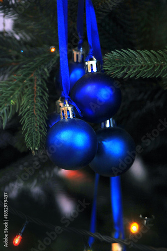 Group of navy blue hanging balls christmas tree decoratin ornament.Christmas holiday , decoration, winter seasonal greeting concept. Free copy space.