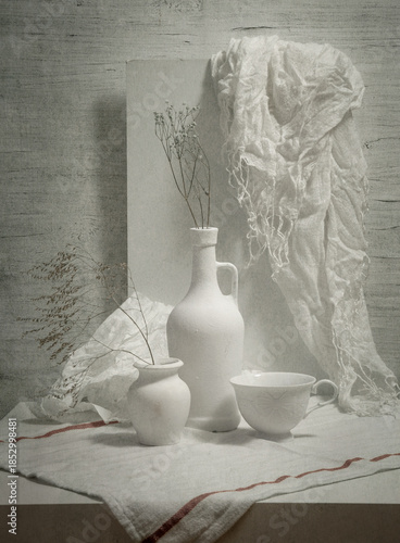 Still life with white dishes on a light background